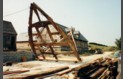 The second cruck frame  from the Hall House going up as the Barn end gable