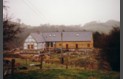 A view of the Main House with the slates on the roof and the south end weatherboarded